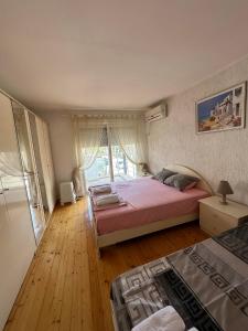 Postel nebo postele na pokoji v ubytování Meri Apartments