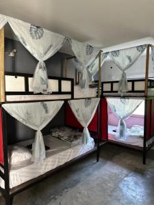 a group of bunk beds in a room at MBAR HOSTEL HAAD RIN in Haad Rin +57 photos