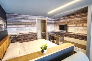 Posteľ alebo postele v izbe v ubytovaní Sui Generis - Aosta Urban Apartments