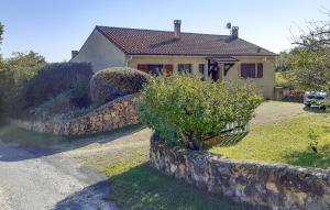 a house with a stone wall in front of it at Lovely Home In Villamblard With Wifi in Villamblard +4 photos