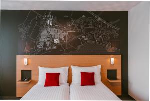 Postel nebo postele na pokoji v ubytování SwissTech Hotel