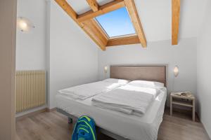 A bed or beds in a room at Residence Lagorai