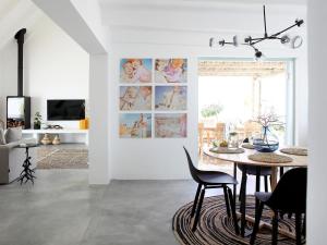 a dining room with a table and chairs at The Cottage Collection Paternoster in Paternoster