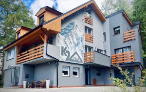 a building with a mural on the side of it at Villa K2 in Karpacz