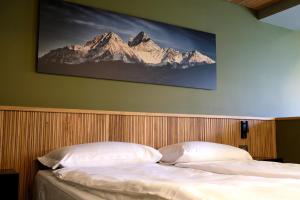 Posteľ alebo postele v izbe v ubytovaní Sui Generis - Aosta Urban Apartments