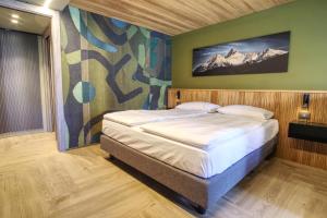 Posteľ alebo postele v izbe v ubytovaní Sui Generis - Aosta Urban Apartments