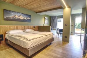 Posteľ alebo postele v izbe v ubytovaní Sui Generis - Aosta Urban Apartments