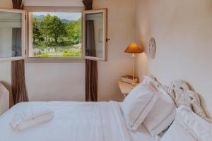 Postel nebo postele na pokoji v ubytování Relais de Charme le Videlle