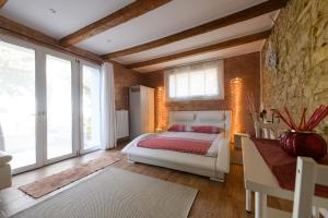 Ένα ή περισσότερα κρεβάτια σε δωμάτιο στο Casetta sulle colline del San giovese