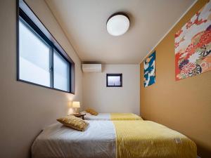 Katil atau katil-katil dalam bilik di 福助 豆腐OsakaTsuruhashi鹤桥5mins walk JR Loop/Namba/USJ