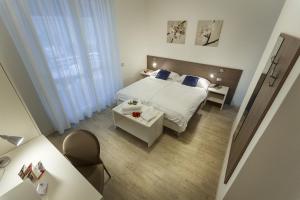 Postel nebo postele na pokoji v ubytování Hotel Roma Aparthotel + 70 fotografií