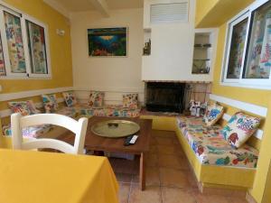 a living room with a couch and a table at -Dorm Hostelworld Camp Backpackers-la girelle in Marseille +1 photo