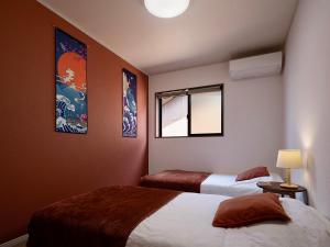 Katil atau katil-katil dalam bilik di 福助 豆腐OsakaTsuruhashi鹤桥5mins walk JR Loop/Namba/USJ