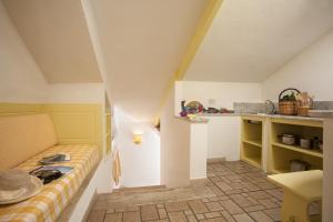 a room with a bed in the corner of a room at Le Roccette Club in Tropea +41 photos