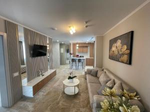 a living room with a couch and a table at Boutique Hotel Balș in Balş