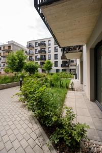 a walkway in front of a building at Widzewska Deluxe Apartment by BookingHost in Łódź