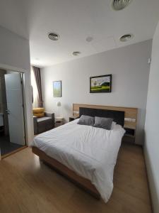 Postel nebo postele na pokoji v ubytování MD Apartmants
