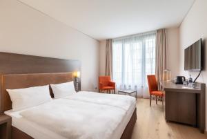 Postel nebo postele na pokoji v ubytování IntercityHotel Dresden