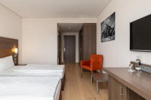 Postel nebo postele na pokoji v ubytování IntercityHotel Dresden