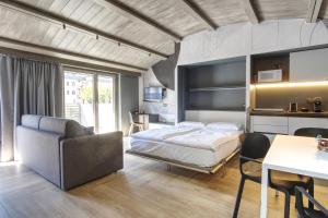 Posteľ alebo postele v izbe v ubytovaní Sui Generis - Aosta Urban Apartments