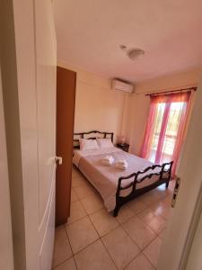 Posteľ alebo postele v izbe v ubytovaní Ostria Seaside Apartments + 28 fotografií