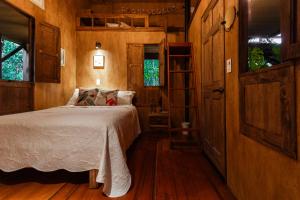 Postel nebo postele na pokoji v ubytování Tominejo Ecolodge - Casas en los árboles