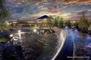 a building with a pond in front of a building at The Great Escape King suite, Kid friendly in Sevierville