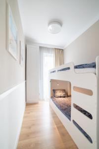 Ένα ή περισσότερα κρεβάτια σε δωμάτιο στο Pobierowo Baltic Apartments A30 +21 φωτογραφίες