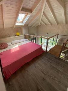 a bedroom with a large bed in a attic at Olympus Theophilia villas in Skotína +92 photos
