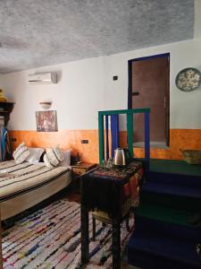 a living room with a couch and a table at Riad Oussagou in Imlil
