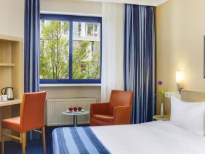 Voodi või voodid majutusasutuse IntercityHotel Nürnberg toas