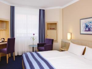 Voodi või voodid majutusasutuse IntercityHotel Nürnberg toas