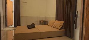 Ένα ή περισσότερα κρεβάτια σε δωμάτιο στο Bale Hendi +1 φωτογραφίες