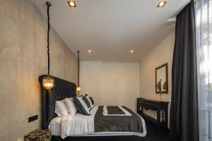 a bedroom with a bed and a large window at VILLA GIMA 1 - 5 bedroom UMALAS in Kerobokan