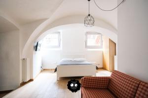 Postel nebo postele na pokoji v ubytování Flat Il Torrazzo XIII Secolo