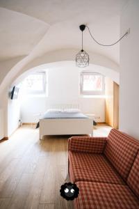 Postel nebo postele na pokoji v ubytování Flat Il Torrazzo XIII Secolo