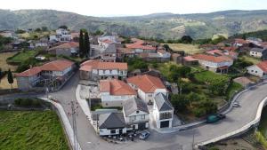 an aerial view of a residential neighborhood with houses at Casa Tome A Teixeira - Ribeira Sacra in Teixeira