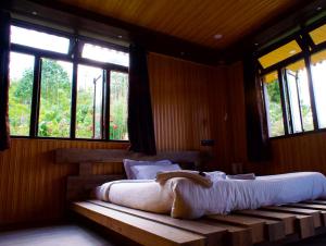 Postel nebo postele na pokoji v ubytování Emaho Boutique Resort