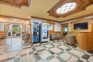 a living room with a checkered floor at Aparthotel Princess in Canazei