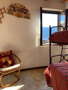 Ένα ή περισσότερα κρεβάτια σε δωμάτιο στο Casa vacanza Macchia a Gatti Triangia +5 φωτογραφίες
