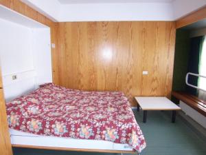 Un ou plusieurs lits dans un hébergement de l'établissement Appartamento Marilleva 1400