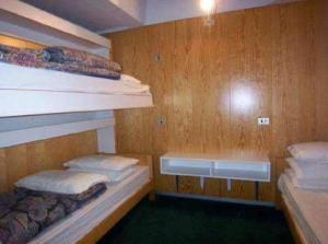 Un ou plusieurs lits dans un hébergement de l'établissement Appartamento Marilleva 1400