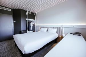 Ibis Luxembourg Airport客房内的一张或多张床位