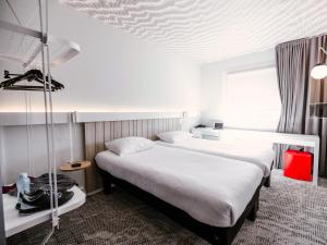 Ibis Luxembourg Airport客房内的一张或多张床位