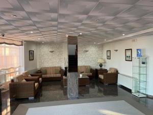 a lobby with couches and a waiting room at Hotel Nuevo Lanzada in A Lanzada +69 photos