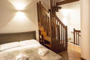 Posteľ alebo postele v izbe v ubytovaní Tina House - Il cortile nel centro storico di Taormina