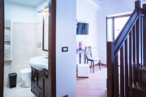 Posteľ alebo postele v izbe v ubytovaní Tina House - Il cortile nel centro storico di Taormina