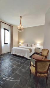 Giường trong phòng chung tại Posada del Cerro