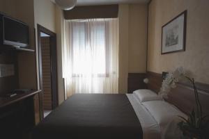 Letto o letti in una camera di Park Hotel Meublé