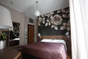 Letto o letti in una camera di Park Hotel Meublé